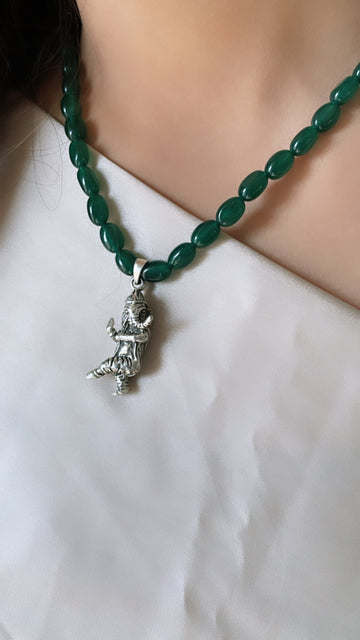 92.5 Silver Dancing Ganpati pendant (threaded in Green Beads)